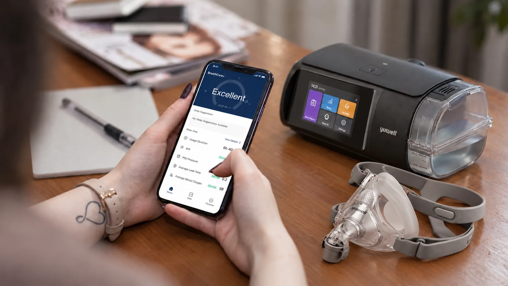 BreathCare+ app showing CPAP therapy data next to a Yuwell device and mask